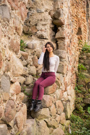 beautiful young girl posing near the riverの写真素材