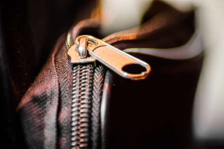 Close up of black leather bag zipperの写真素材