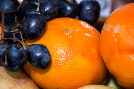 juicy close-up of tangerines with grapeの写真素材