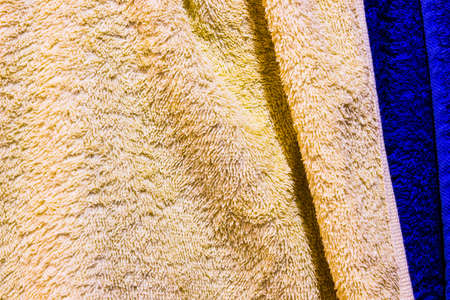 Beautifully Lit Yellow and blue Fabric Texture or backgroundの写真素材