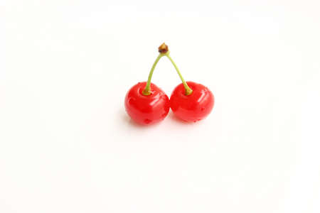 Red fresh cherries on white backgroundの写真素材