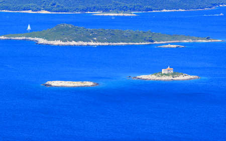 Lighthouse on islet near Korcula island in Croatiaの写真素材