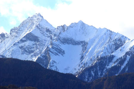 Alpine peaks in winter sunny dayの写真素材