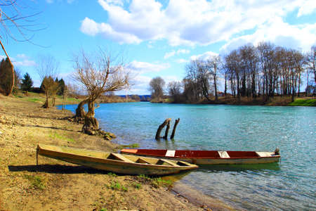 Old boats on river coastの写真素材