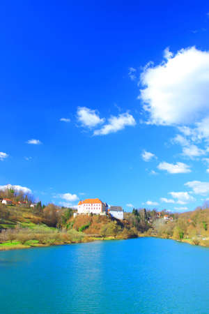 River Kupa and Castle on hill, Ozalj in Croatia, blue sky with clouds in backgroundのeditorial素材