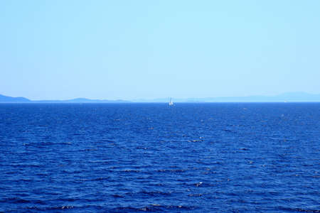 Sailing boat near islands Brac and Hvar on Adriatic sea in Croatiaの写真素材