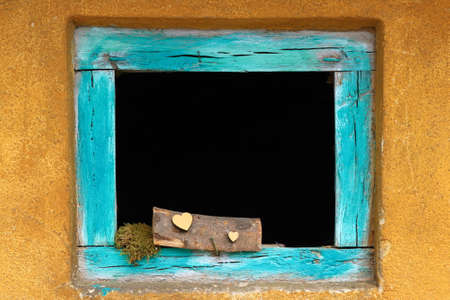 Old wooden window on abandoned house with conceptual love messageの写真素材