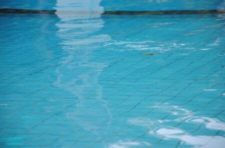 Pure blue water in the swimming pool. Water background.の写真素材