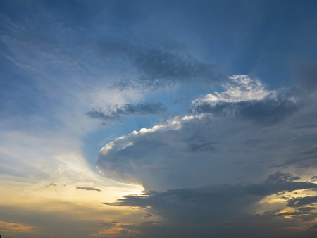 Beautiful sunset with cumulonimbus clouds abstract backgroundの写真素材