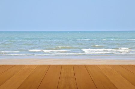 wood floor on sand beach with sea and blue sky beautiful natural tropical sea