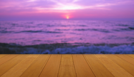 wood floor on sea with purple sunset Burning Skie beautiful natural tropical sea
