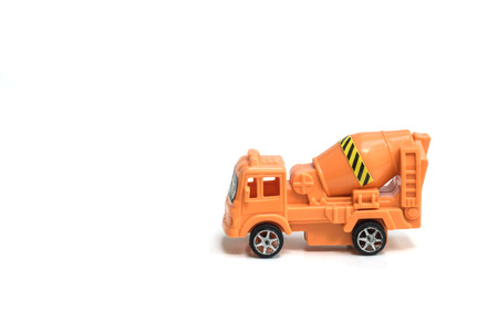 Toy truck concrete mixer vehicle machine cement mixer children toy isolated on white backgroundの写真素材