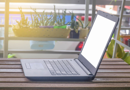 PC laptop, tablet on wooden tableの写真素材