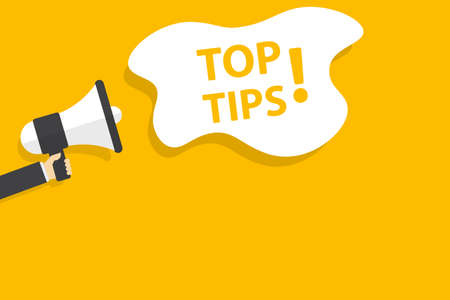 hand holding megaphone with top tips speech bubble banner vector with copy space for business, marketing, flyers, banners, presentations and posters. illustrationのイラスト素材
