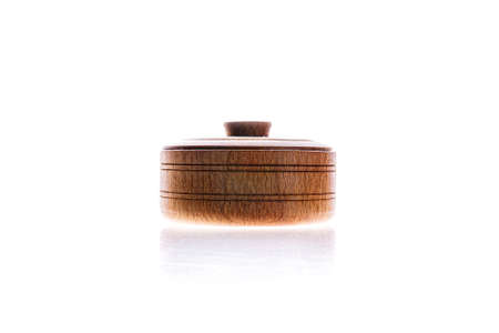 Brown wooden salt or spices pot or casket isolated on white background