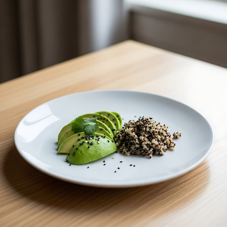 Avocado with quinoa in a white plate on a wooden tableの素材