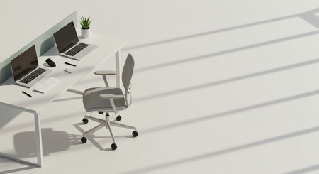 A clean, modern office interior viewed from above. A solitary desk and chair sit in the corner, while dramatic linear shadows cut across the vast, empty white floor.の素材