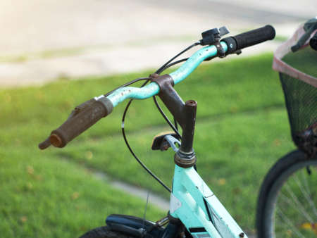 Hands in gloves holding handlebar of a bicycle.の写真素材