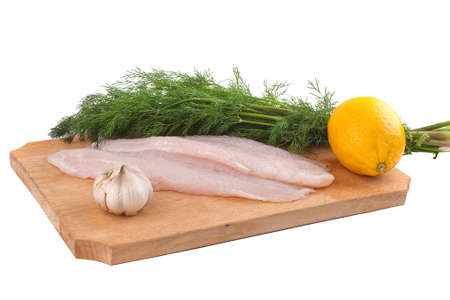 Fish, lemon, garlic and fresh dill isolated on white backgroundの写真素材