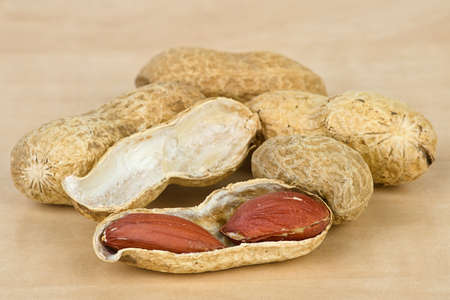 Closeup photo of peanuts on wooden table