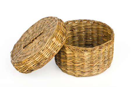 Straw basket isolated on white backgroundの写真素材