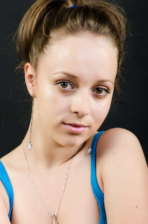 Closeup with girl posing on dark backgroundの写真素材