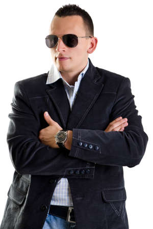 Attractive man with sunglasses posing in studio isolated on whiteの写真素材