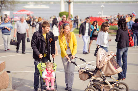 Volgograd, Russia - May 9, 2014: Ivanov's family with children walks on the Volgograd quay.  This day is celebrated by the most revered holiday in Russia - Victory Day.のeditorial素材
