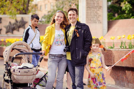 Volgograd, Russia - May 9, 2014: Ivanov's family with children walks down the avenue of heroes of Volgograd. This day is celebrated by the most revered holiday in Russia - Victory Day.のeditorial素材