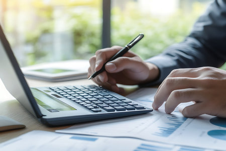 Businessman analyzing investment charts with laptop. Accounting,investment concept.の素材