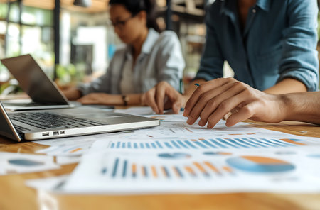 Close up of business people working together in office. Teamwork conceptの素材