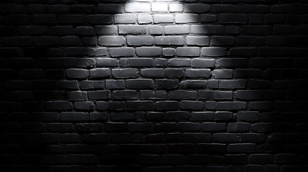 Spotlight on black brick wall. Abstract background for your design.の素材