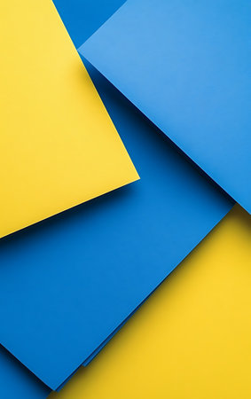 Abstract geometric background of blue and yellow paper sheets. Minimal concept.の素材