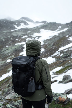 Hiker with backpack on the trail in the mountains, Norway.の写真素材