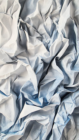 Crumpled white paper as a background, closeup of photoの写真素材