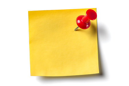 close up of a note paper with a push pin on white backgroundの写真素材