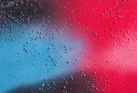 Abstract background with drops of paint in red, blue and pink colorsの写真素材