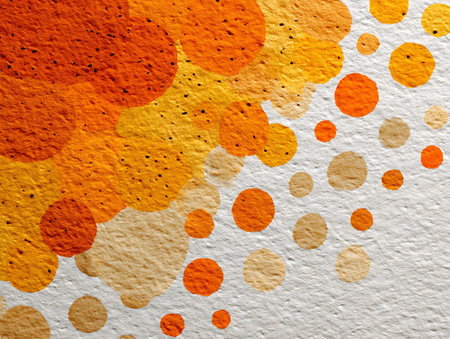 Orange and yellow spots on a white wall. Abstract background for design.の写真素材