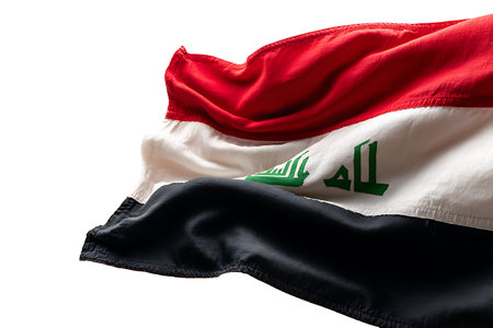Iraq national flag waving in the wind isolated on white background with clipping pathの素材