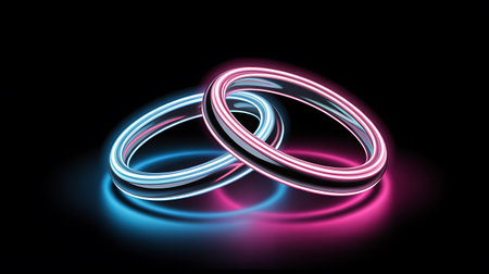 Wedding rings in neon light on black background. Vector illustrationの写真素材