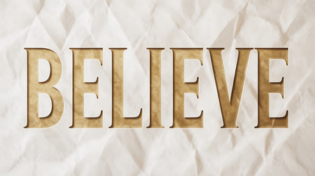 BELIEVE golden text on crumpled paper background.の写真素材