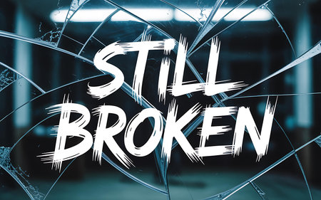 \Word \"\"STILL BROKEN\"\" on broken glass.\""の写真素材