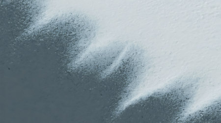 abstract background, texture of white paint on a gray wall with cracksの写真素材