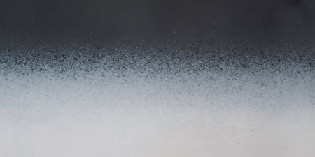 abstract black background texture with some fine grain and dust in itの写真素材