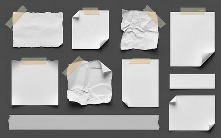 collection of various white note papers on grey background. each one is shot separatelyの写真素材
