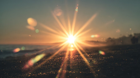 Sunset over the sea with rays of light and bokehの写真素材