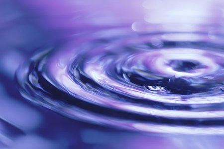 abstract water drop macro close up with purple and violet color backgroundの写真素材