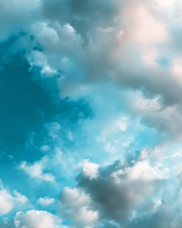 Blue sky background with tiny clouds. Abstract nature background with copy spaceの写真素材