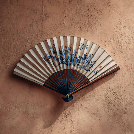 Folding fan on the wall of a house in the city.の写真素材