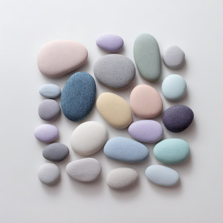 Colorful pebbles on white background. Flat lay, top viewの写真素材